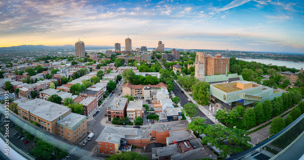 Fototapeta premium Wide and panoramic aerial view of Quebec city cityscape at sunset, after a warm summer day, QC, Canada