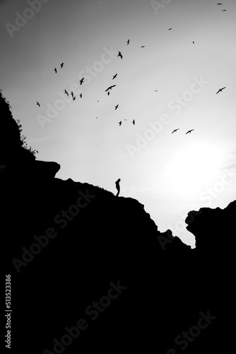 Man standing on cliff 