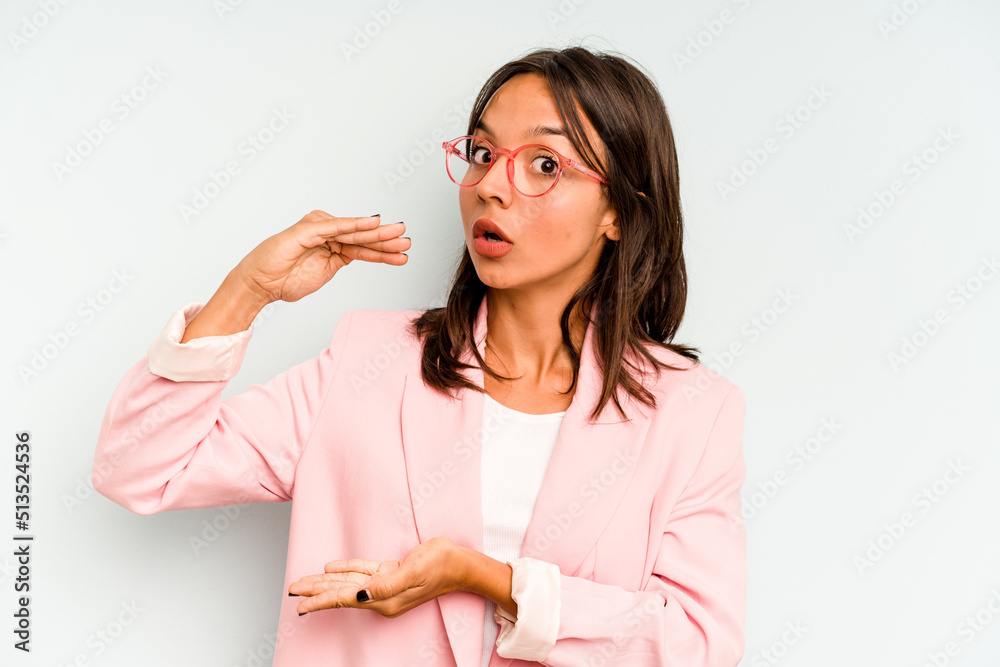 Young hispanic woman isolated on blue background smiling cheerful showing number five with fingers. Young hispanic woman isolated on blue background smiling cheerful showing number five with fingers.