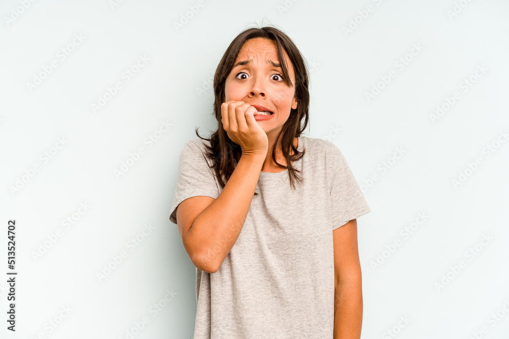 Young hispanic woman isolated on blue background dancing and having fun. Young hispanic woman isolated on blue background dancing and having fun.