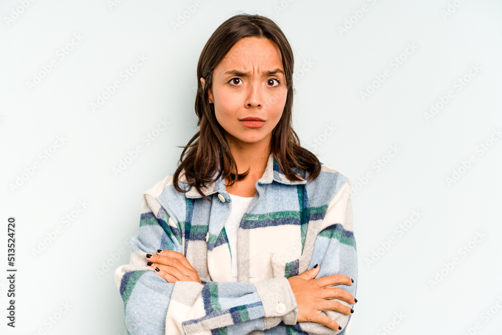 Young hispanic woman isolated on blue background cheerful smiles pointing to front. Young hispanic woman isolated on blue background cheerful smiles pointing to front.
