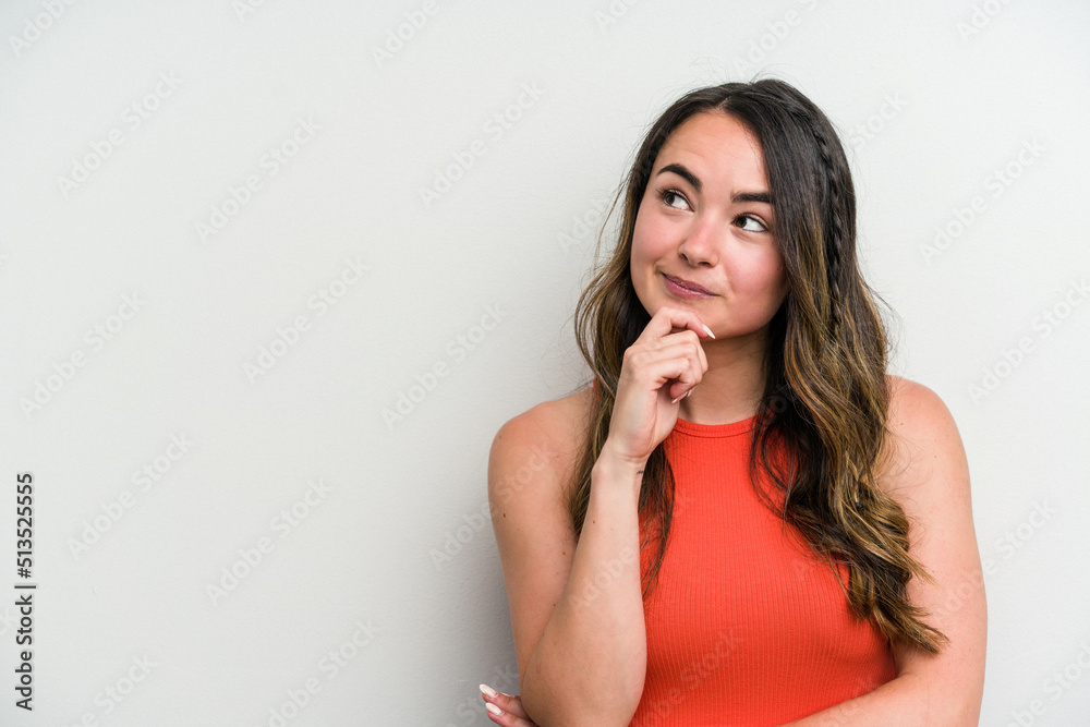 Young caucasian woman isolated on white background looking sideways with doubtful and skeptical expression. Young caucasian woman isolated on white background looking sideways with doubtful and skeptical expression.