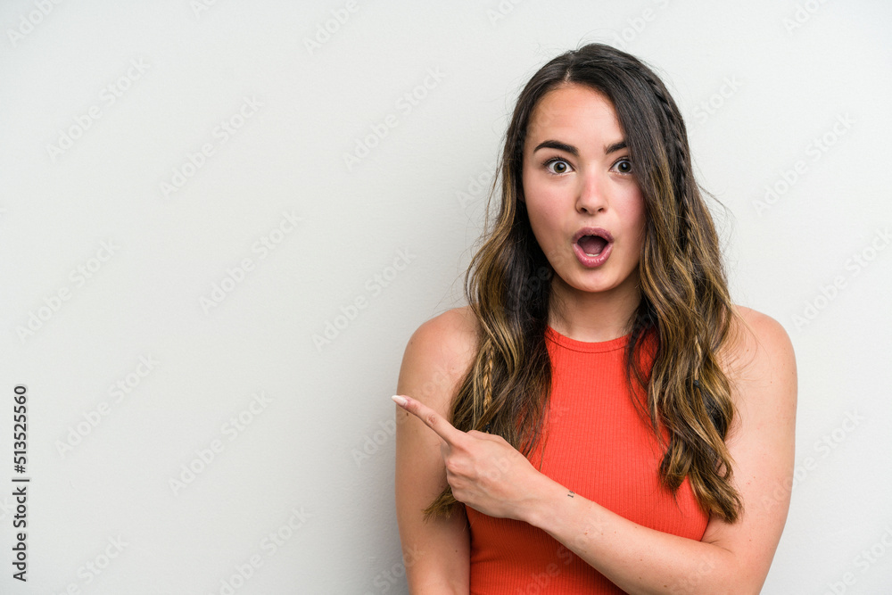 Young caucasian woman isolated on white background pointing to the side Young caucasian woman isolated on white background pointing to the side