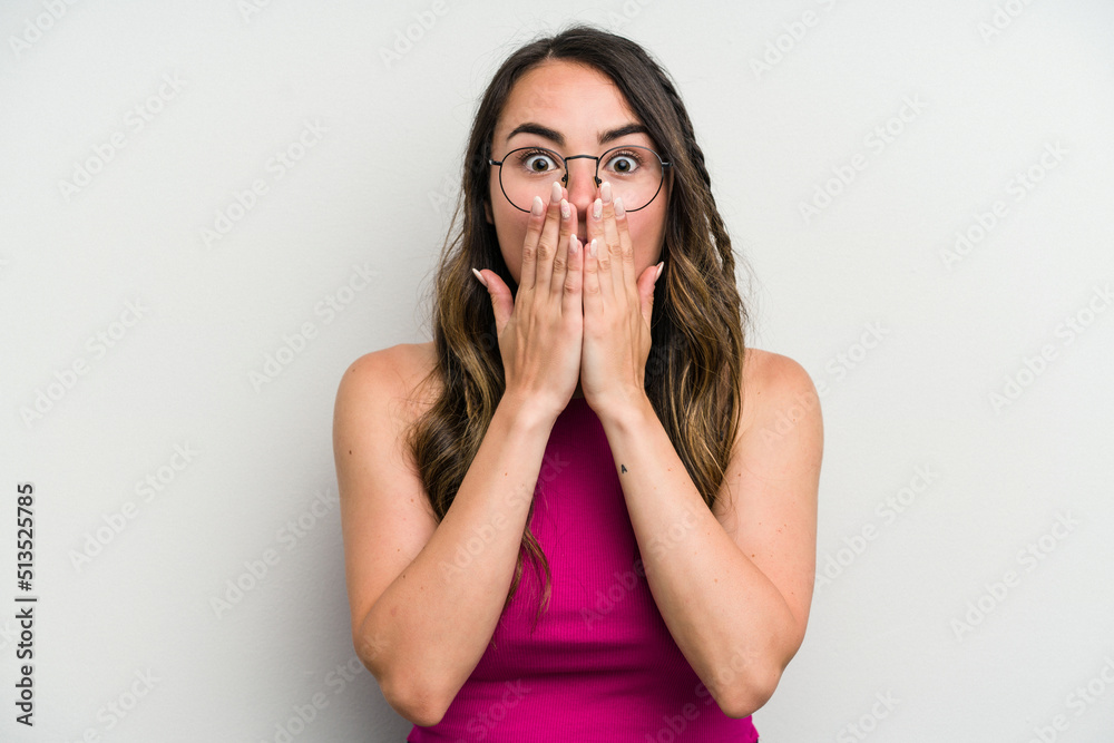 Young caucasian woman isolated on white background shocked covering mouth with hands. Young caucasian woman isolated on white background shocked covering mouth with hands.