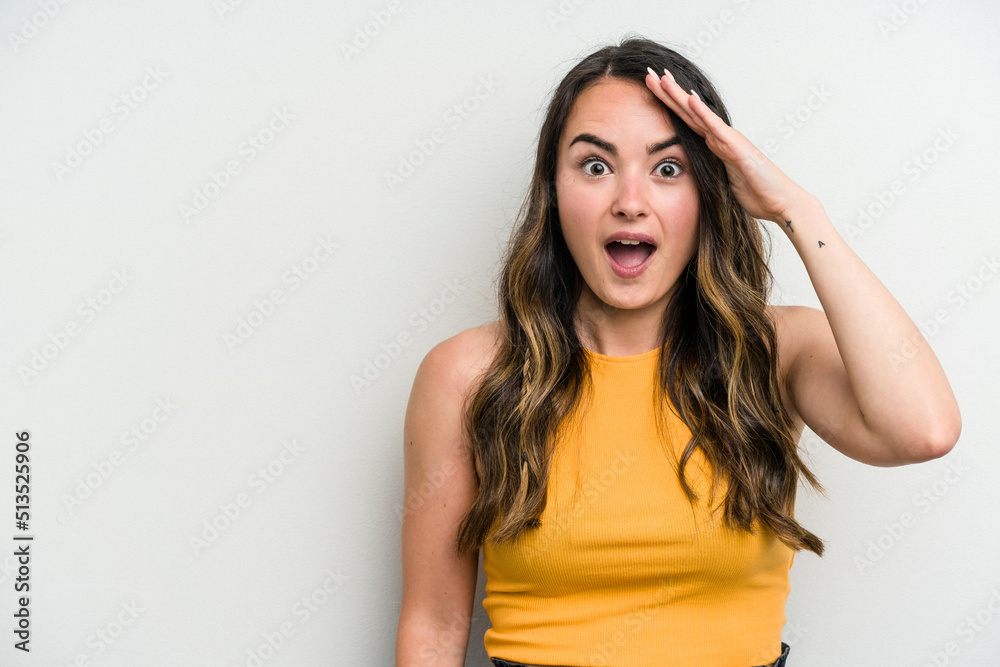 Young caucasian woman isolated on white background shouts loud, keeps eyes opened and hands tense. Young caucasian woman isolated on white background shouts loud, keeps eyes opened and hands tense.