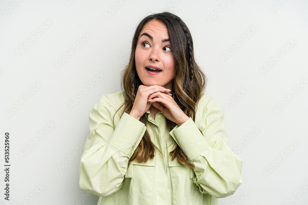 Young caucasian woman isolated on white background praying for luck, amazed and opening mouth looking to front. Young caucasian woman isolated on white background praying for luck, amazed and opening mouth looking to front.