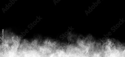 Very small drops of steam in chaotic motion on a black background