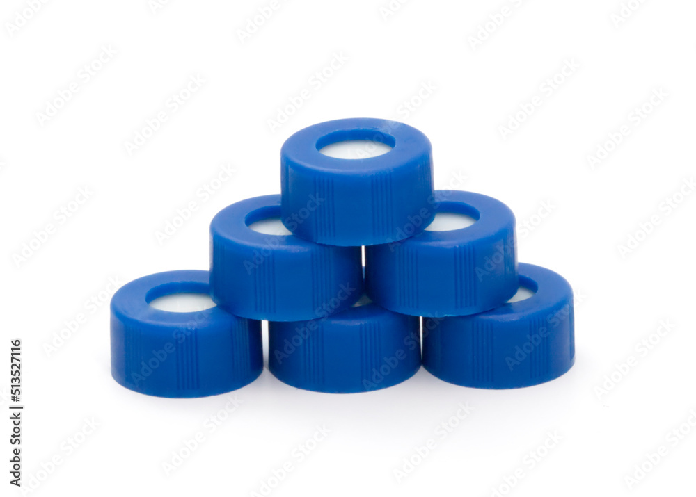 lot of blue plastic vial screw caps isolated on white background lot of blue plastic vial screw caps isolated on white background