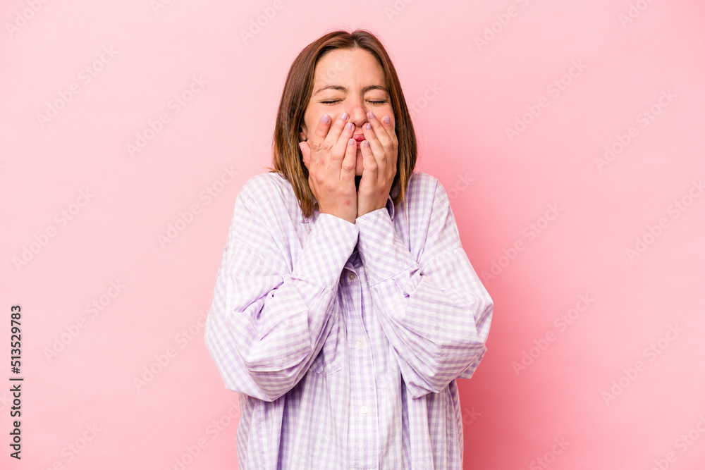 Young caucasian pregnant woman isolated on white background laughing about something, covering mouth with hands. Young caucasian pregnant woman isolated on white background laughing about something, covering mouth with hands.