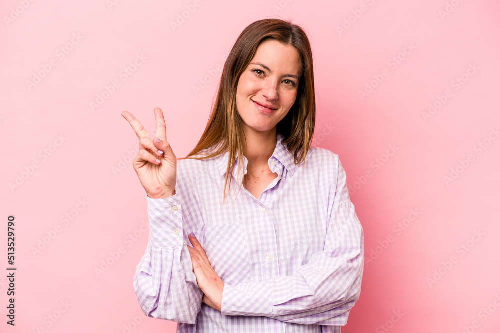 Young caucasian pregnant woman isolated on white background showing number two with fingers. Young caucasian pregnant woman isolated on white background showing number two with fingers.