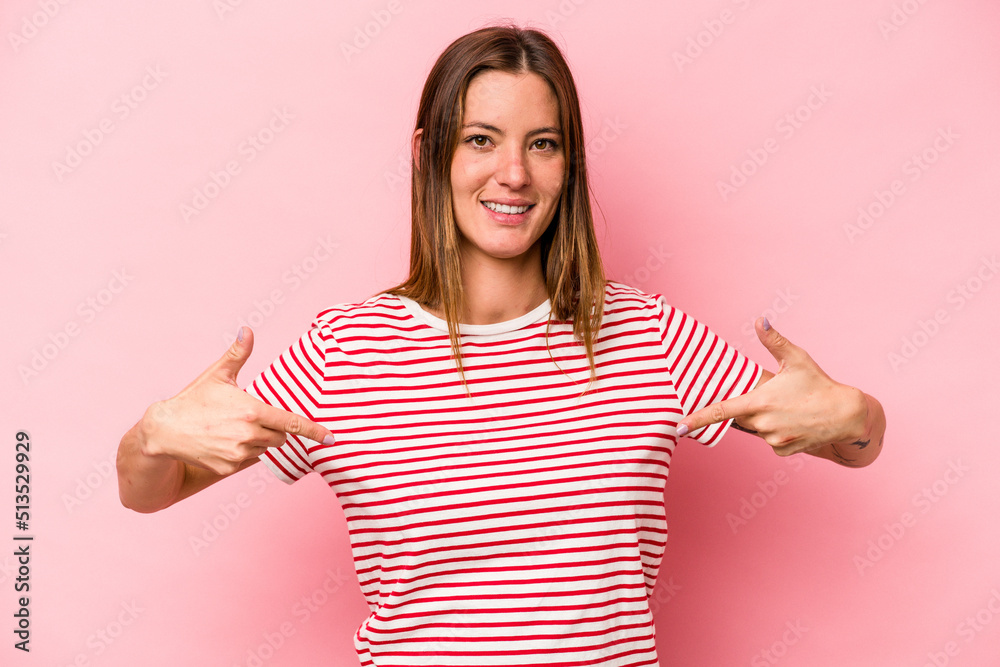 Young caucasian pregnant woman isolated on white background points down with fingers, positive feeling.