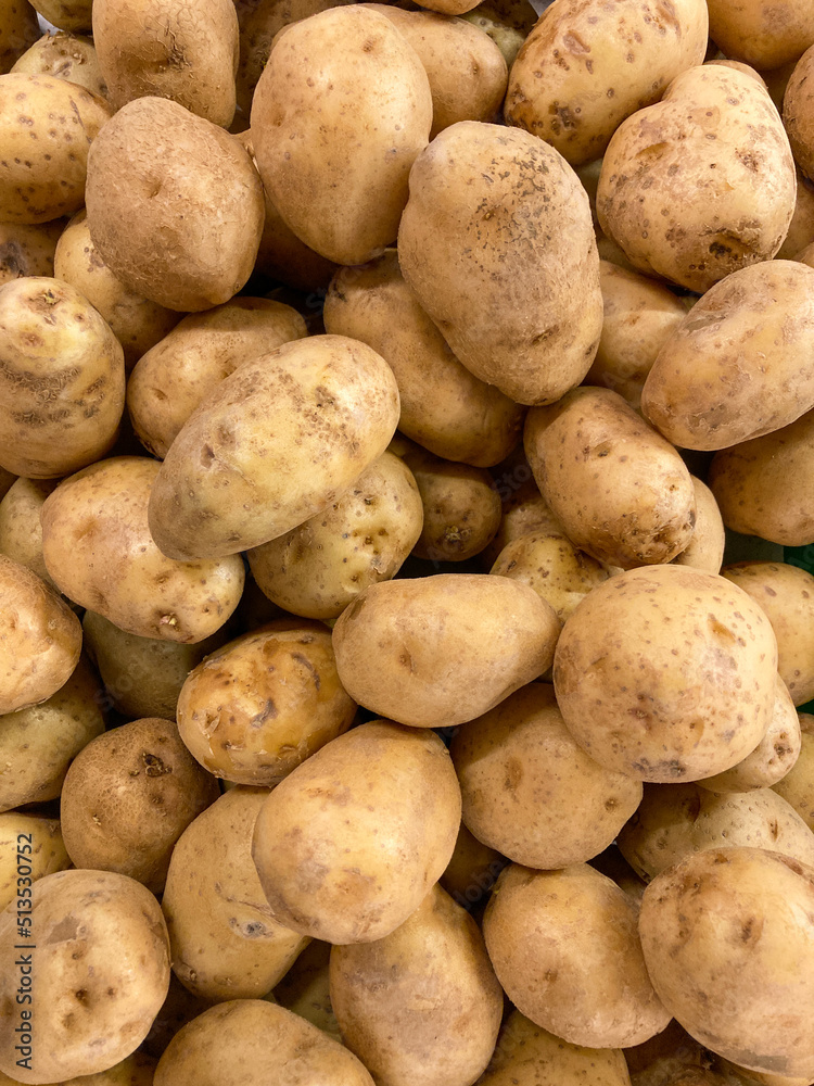 Fresh organic potatoes in the market. Close-up potatoes texture Fresh organic potatoes in the market. Close-up potatoes texture