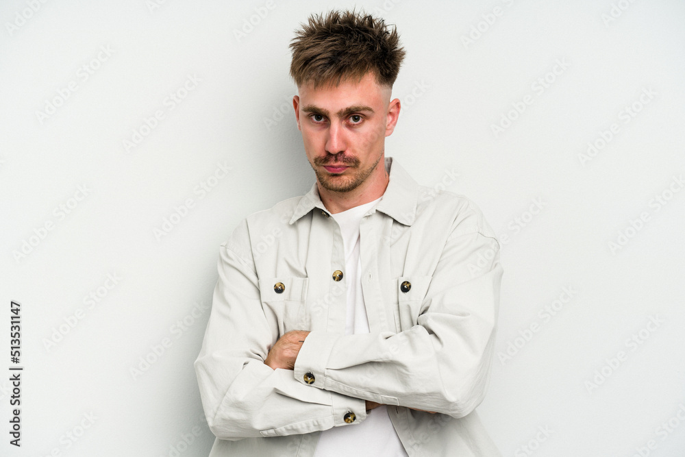 Young caucasian man isolated on white background unhappy looking in camera with sarcastic expression. Young caucasian man isolated on white background unhappy looking in camera with sarcastic expression.