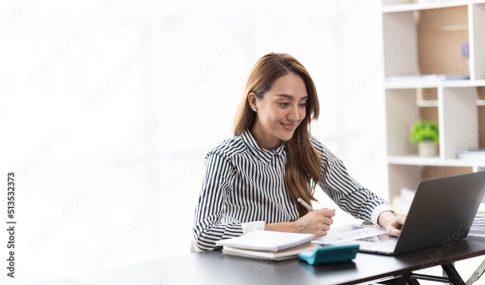 Portrait of smiling beautiful business asian woman working in office use computer with copy space. Business owner people sme freelance online marketing e-commerce telemarketing, work from home concept Portrait of smiling beautiful business asian woman working in office use computer with copy space. Business owner people sme freelance online marketing e-commerce telemarketing, work from home concept