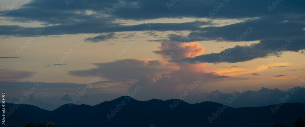 Sunset, clouds, beautiful color changing over the mountains, beautiful colors, panorama shot.