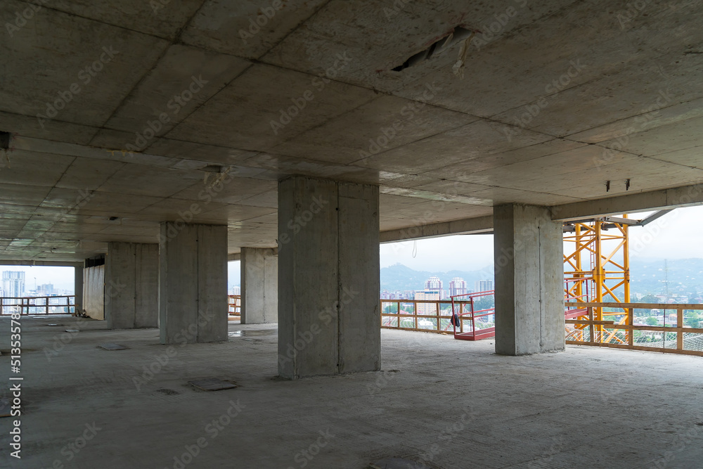 An apartment building under construction. Construction process, walls, partitions. Building frame