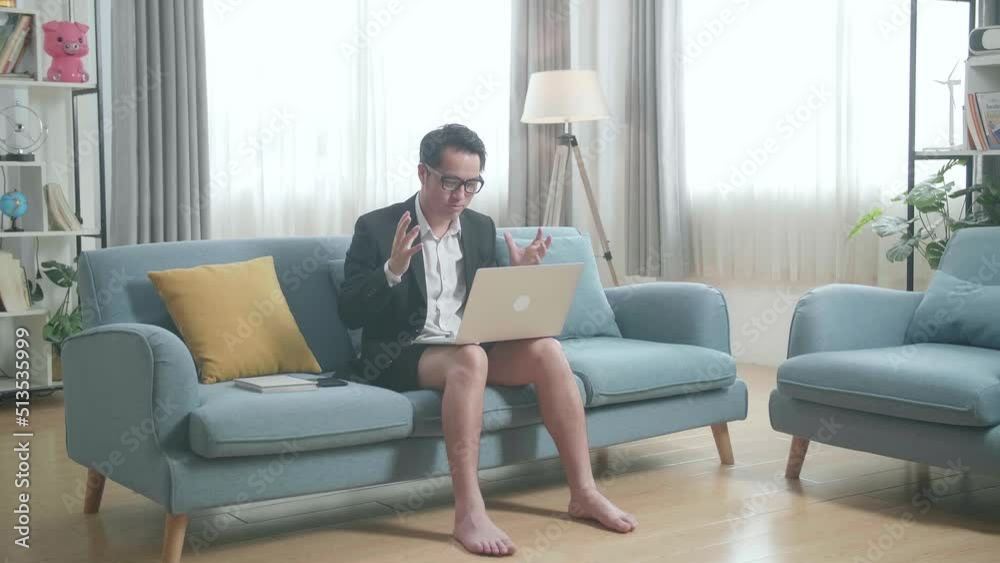 Full View Of Asian Businessman In Jacket And Shorts Having Video Call On A Laptop At Home
Full View Of Asian Businessman In Jacket And Shorts Having Video Call On A Laptop At Home