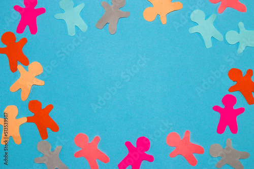 colorful paper people arranged in a circle in the middle blue copy space, creative design, population day, all people are equal and important