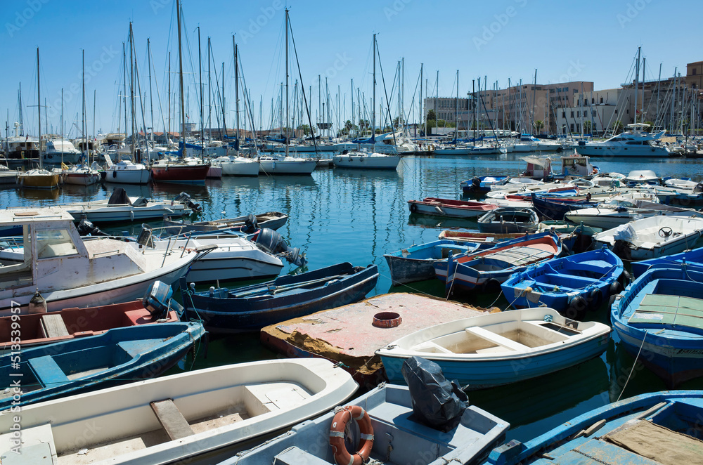 Palermo, Sicily - July 29, 2016: Small port with fishing boats in the center of Mondello