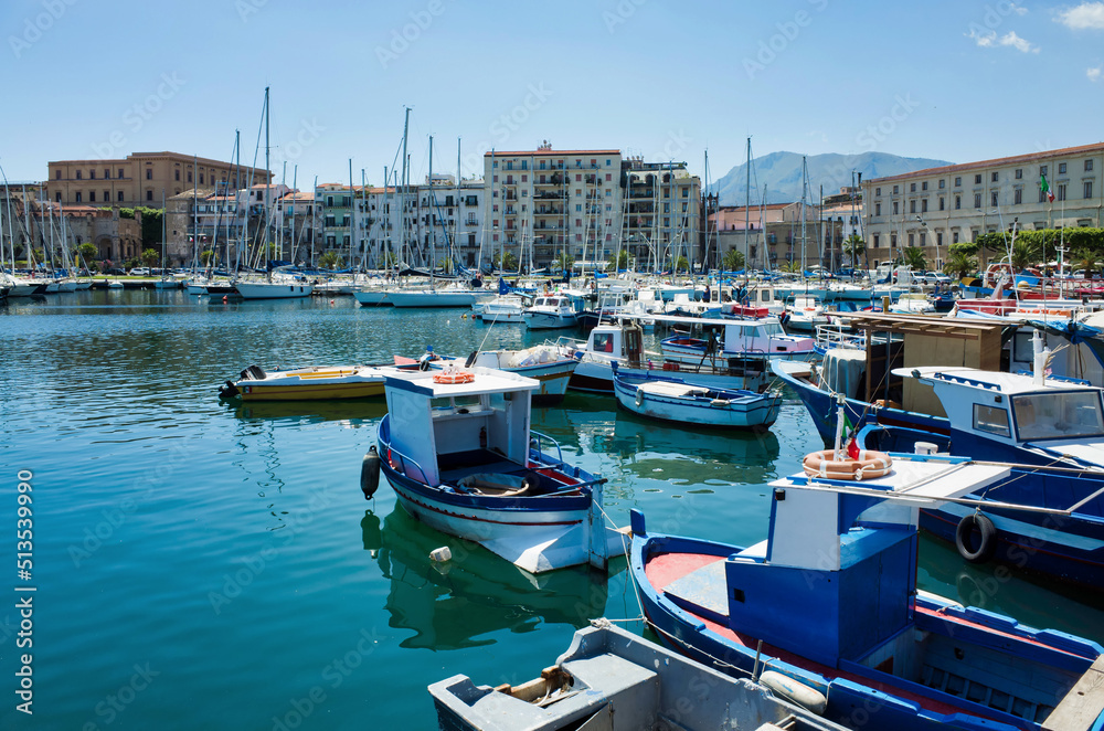 Palermo, Sicily - July 29, 2016: Small port with fishing boats in the center of Mondello