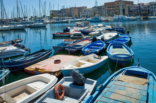 Palermo, Sicily - July 29, 2016: Small port with fishing boats in the center of Mondello