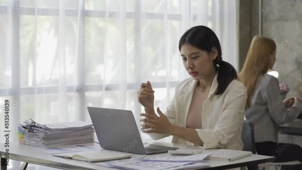 Asian female accountant working with financial graph documents, calculate taxes for charts and graph reports of home income. Businesswoman working on laptop computer and planning expenses budget. Asian female accountant working with financial graph documents, calculate taxes for charts and graph reports of home income. Businesswoman working on laptop computer and planning expenses budget.