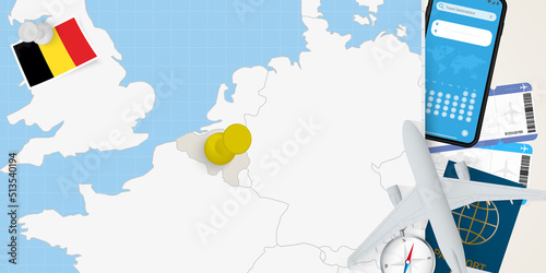 Travel to Belgium concept, map with pin on map of Belgium. Vacation preparation map, flag, passport and tickets.
