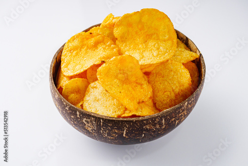 golden crispy potato chips on a white background