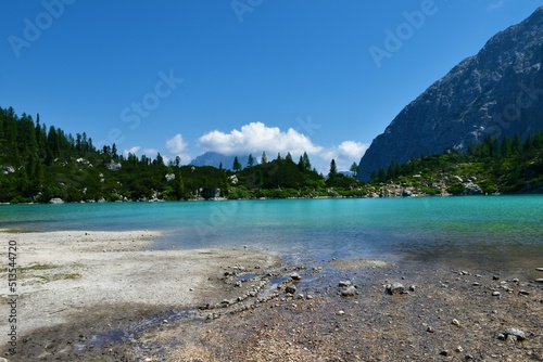 View of turquoise colored lake Sorapis in Dolomite mountains near Cortina d'Ampezzo in Veneto region and Belluno province in Italy