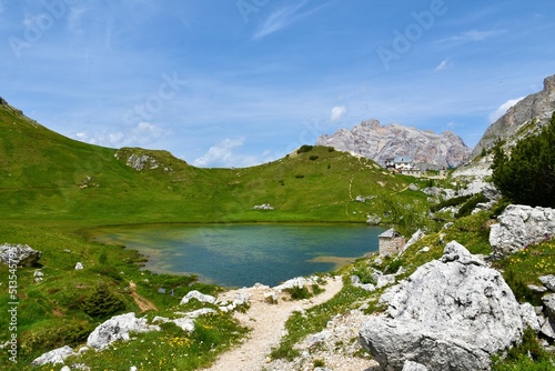 View of lake Valparola and Cima Centurines behind the Refugio Passo Valparola in Dolomite Alps in Veneto region and Belluno province in Italy