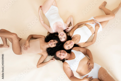 group of young girls of different sizes and races. Smiling together. Beautiful bodies. Natural beauty. Self-love.