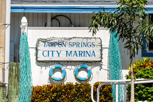 Tarpon Springs, Florida colorful blue white Greek European small town sunny day sign for city marina at harbor with nobody photo