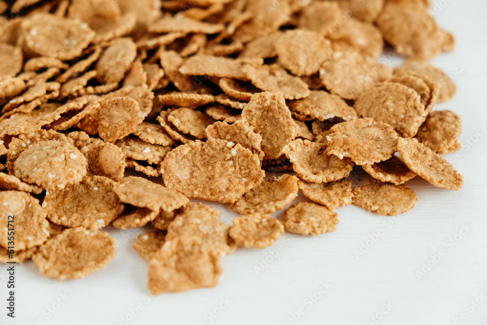 Crispy healthy dry cereal flakes on white background Crispy healthy dry cereal flakes on white background