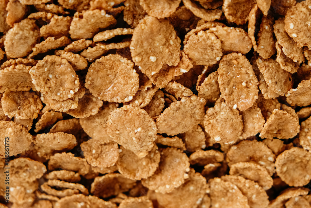 Crispy healthy dry cereal flakes as a background texture