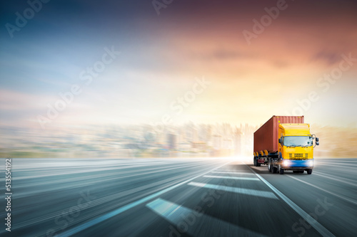 Transportation and logistics concept  Speed delivery of Container truck on highway at sunset sky with copy space  Global Business logistics import export and cargo truck transport industry background