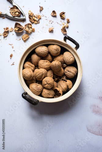 Saucepan full of fresh walnuts photo