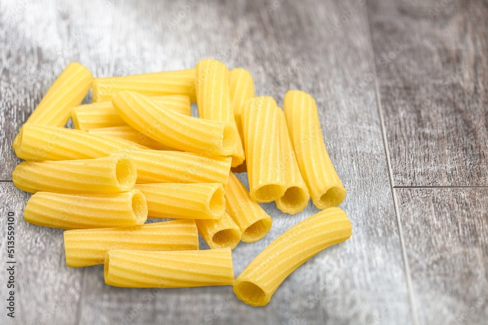 Penne pasta. Raw italian pasta on background, Penne pasta. Raw italian pasta on background,