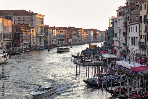Venice, Italy - September 04, 2018: Wide angle view of famous Canal Grande. Colorful spring view from Rialto Bridge, Picturesque morning seascape of Adriatic Sea. Traveling concept background © Arpan