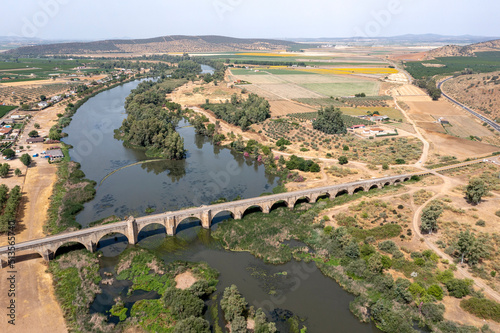 Aerial view of the Roman bridge over the Guadiana river in Medellin, a Spanish municipality in the province of Badajoz, Extremadura. Spain photo
