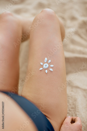 Sunscreen Sun Drawing Lotion On Suntan Legs Tanning On Beach. Woman With Sunblock Cream In Shape On Leg. Care Concept
