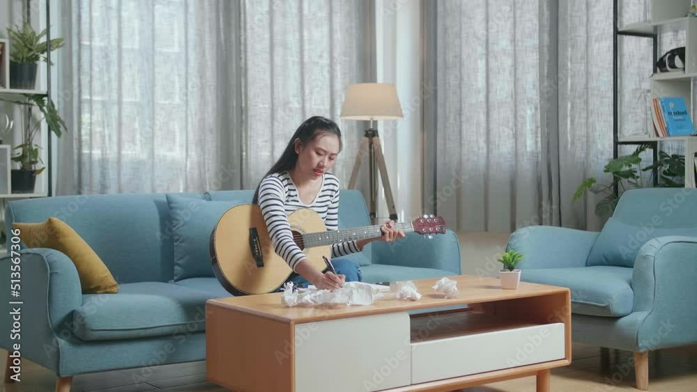 Asian Woman Composer With A Guitar Crumpled Paper And Throw It Away Then Having A Headache While Composing Music At Home
Asian Woman Composer With A Guitar Crumpled Paper And Throw It Away Then Having A Headache While Composing Music At Home