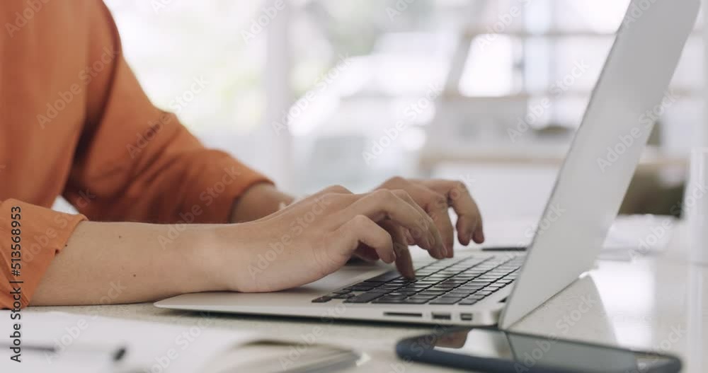 Closeup hands and fingers of a business woman working on a laptop in her office. Female entrepreneur typing on her computer. The success of a small business startup takes hard work and dedication