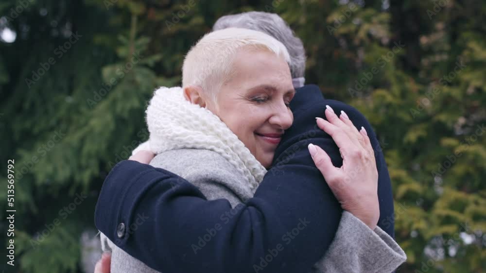 Couple in their 50s hugging, spending time together, romantic walk, bonding Couple in their 50s hugging, spending time together, romantic walk, bonding