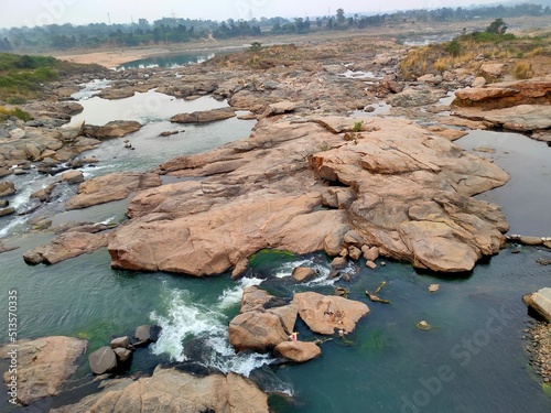 A beautiful Damodar river with some big rocks in it in India photo