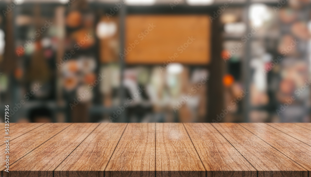 Empty wooden table top with lights bokeh on blur restaurant background. Empty wooden table top with lights bokeh on blur restaurant background.