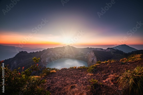 Scenic view of a beautiful sunrise over Kelimutu volcano in Indonesia photo