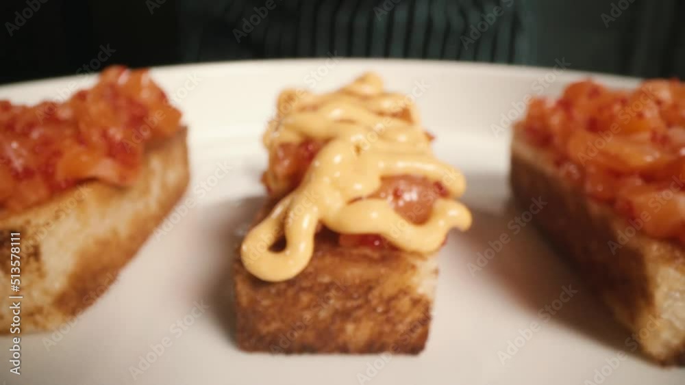 red fish on a sandwich is poured with creamy sauce red fish on a sandwich is poured with creamy sauce