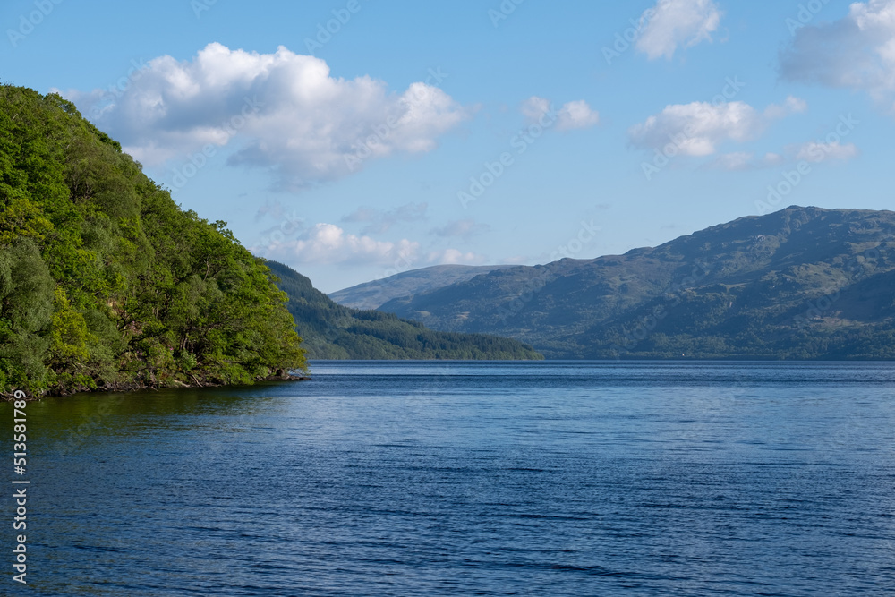 View of the still water at Loch Lomond, Highlands of Scotland, UK. View of the still water at Loch Lomond, Highlands of Scotland, UK.
