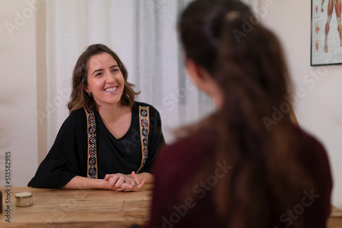 A female therapist talking to a client