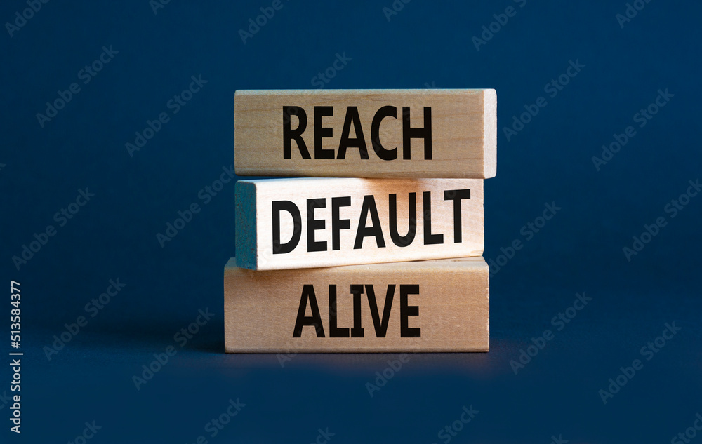 Reach default alive symbol. Concept words Reach default alive on wooden blocks on a beautiful grey table grey background. Business, finacial and reach default alive concept. Copy space. Reach default alive symbol. Concept words Reach default alive on wooden blocks on a beautiful grey table grey background. Business, finacial and reach default alive concept. Copy space.